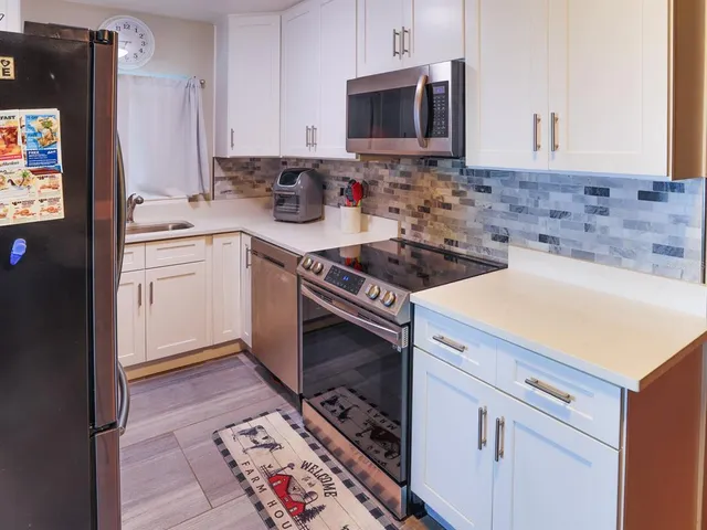 a view of an empty room and a window