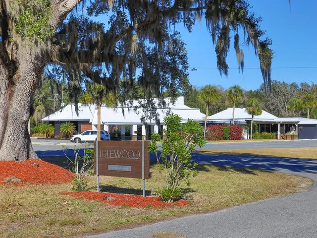 a view of a building with trees in the background