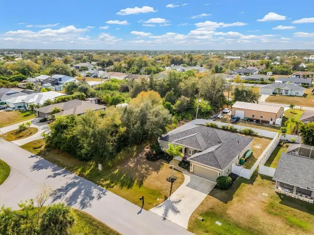 an aerial view of residential houses with outdoor space