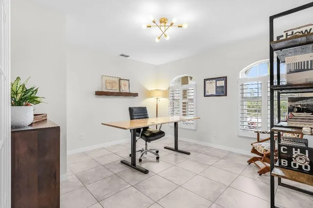 a view of a workspace with furniture