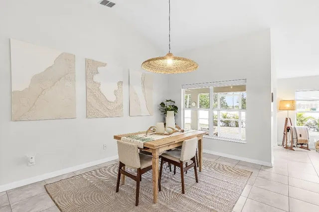 a dining room with furniture and window
