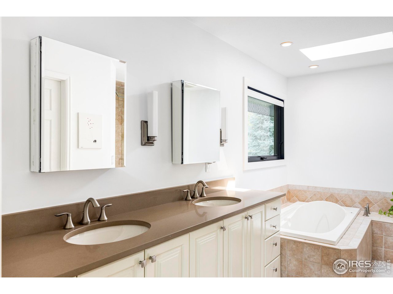 6095 Old Brompton Road Boulder, CO 80301 - Photo 20 of 34 a bathroom with a sink and a mirror