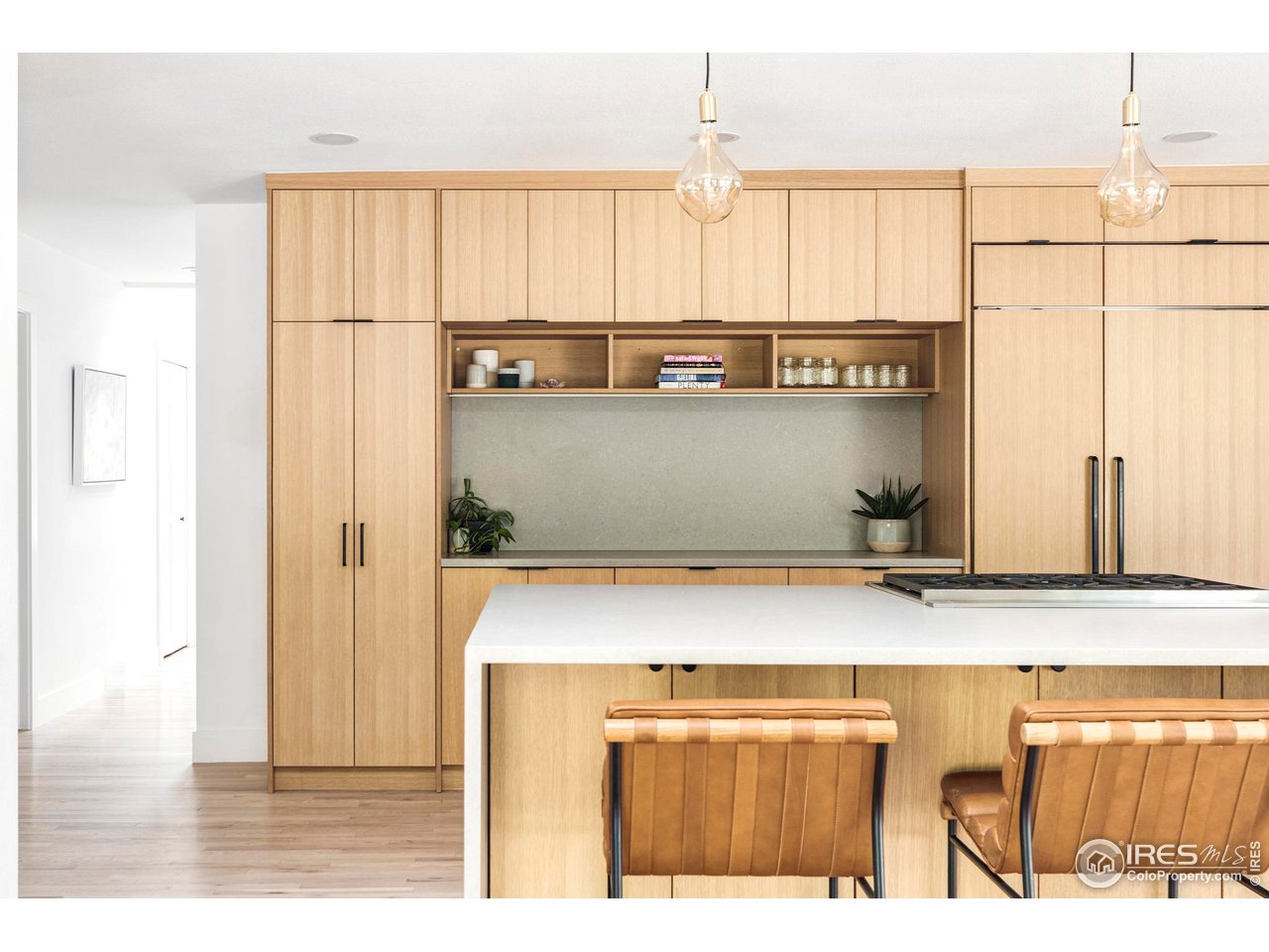 6095 Old Brompton Road Boulder, CO 80301 - Photo 2 of 34 a view of a kitchen with furniture and wooden floor