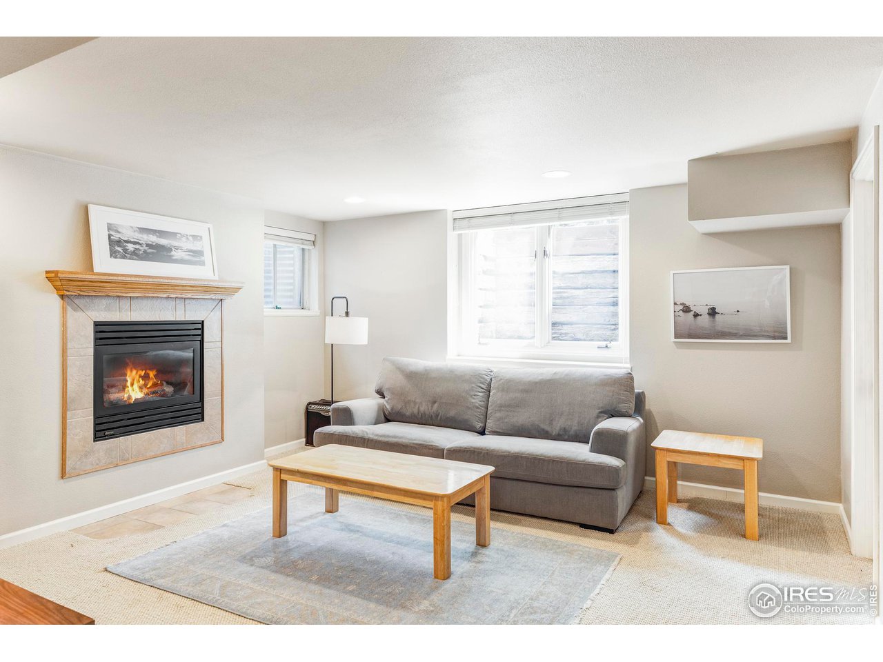 6095 Old Brompton Road Boulder, CO 80301 - Photo 24 of 34 a living room with furniture and a fireplace