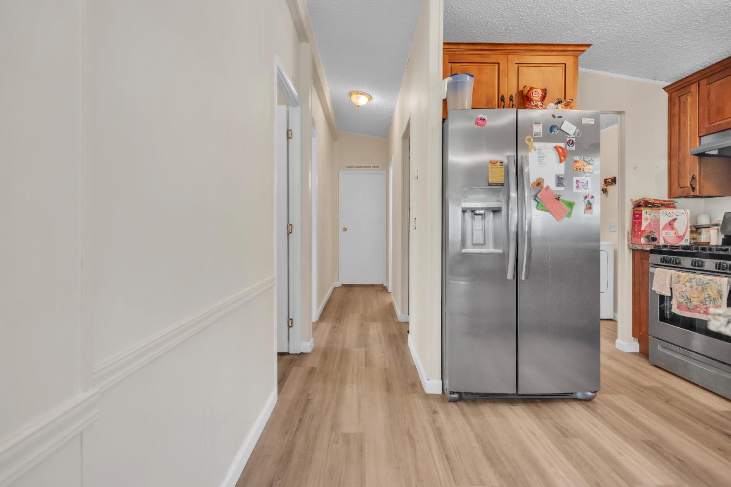 8074 Perry Creek Road, Unit 31 Somerset, CA 95684 - Photo 13 of 20 a view of a refrigerator in kitchen and an empty room