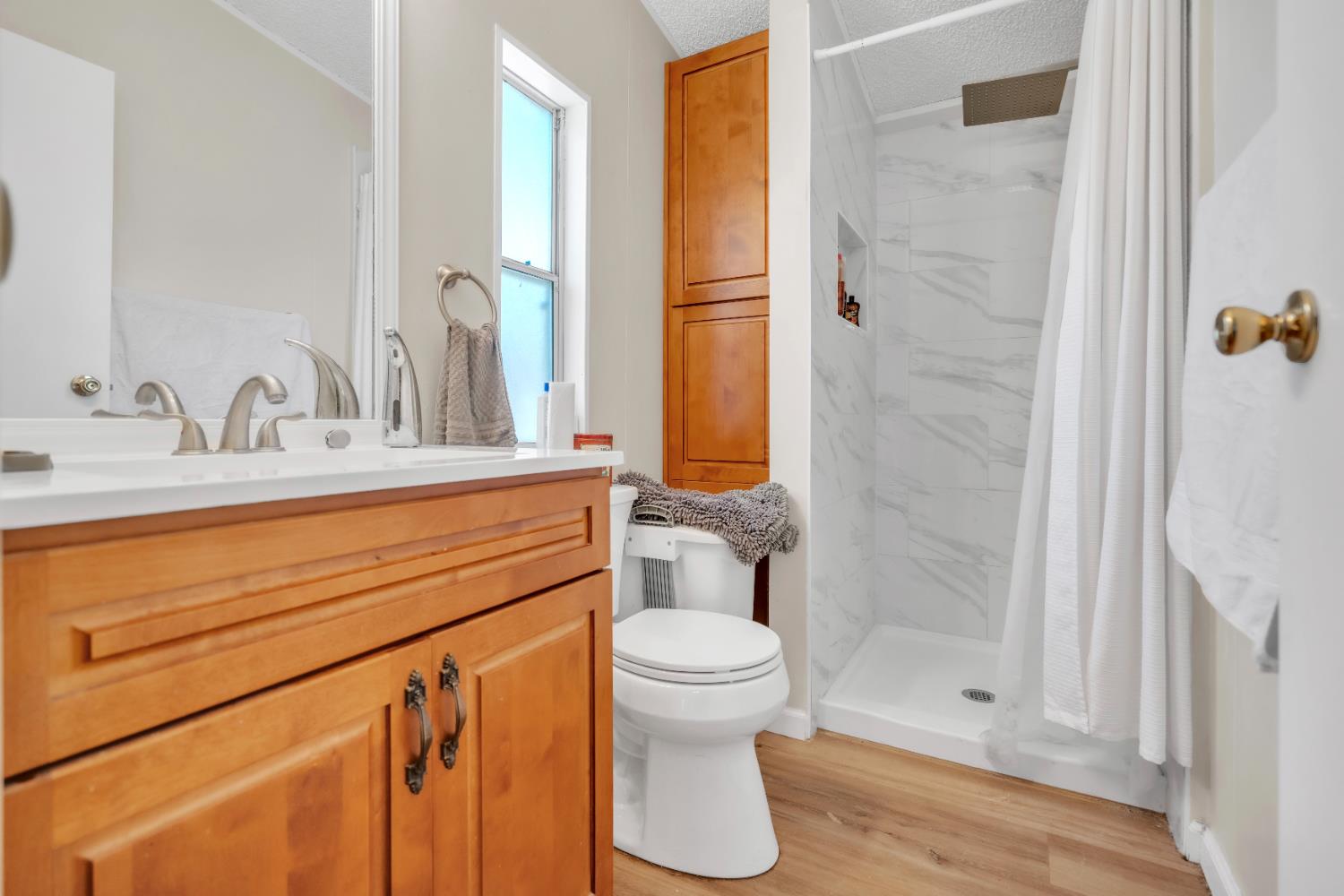 8074 Perry Creek Road, Unit 31 Somerset, CA 95684 - Photo 16 of 20 a bathroom with a sink a toilet and shower