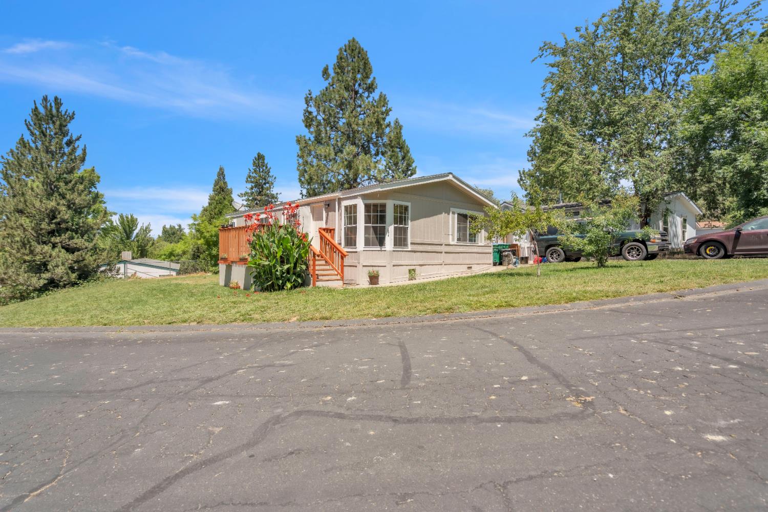 8074 Perry Creek Road, Unit 31 Somerset, CA 95684 - Photo 20 of 20 a front view of a house with a yard and garage
