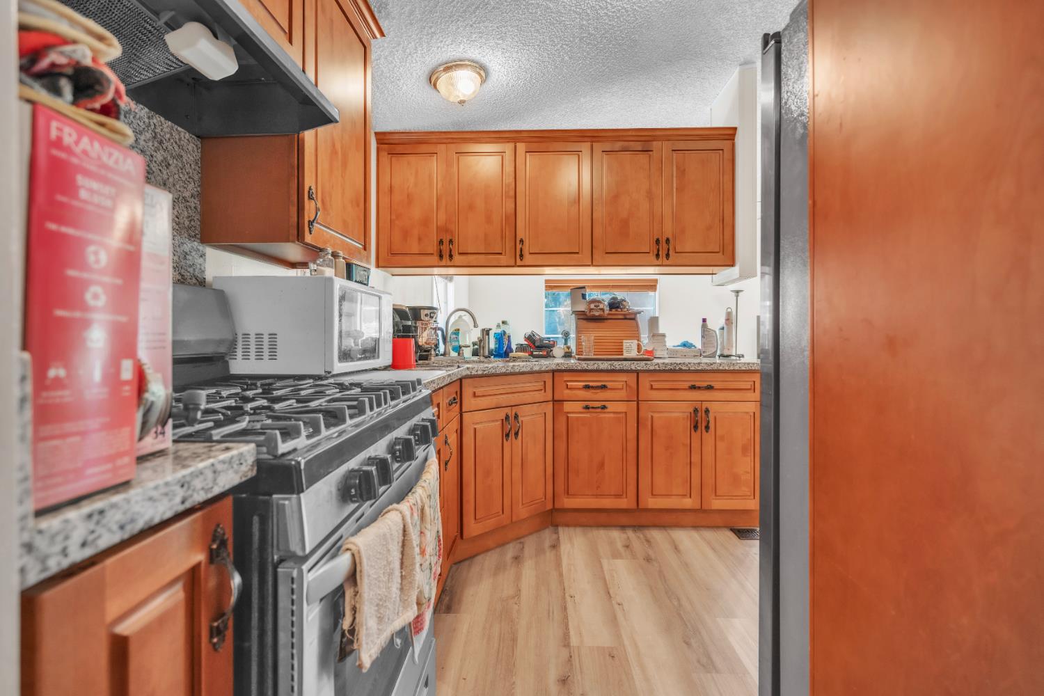 8074 Perry Creek Road, Unit 31 Somerset, CA 95684 - Photo 8 of 20 a kitchen with stainless steel appliances granite countertop a stove and a sink
