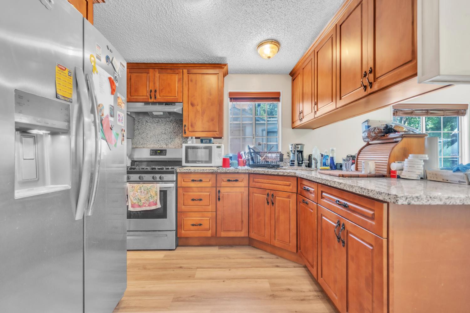 8074 Perry Creek Road, Unit 31 Somerset, CA 95684 - Photo 9 of 20 a kitchen with stainless steel appliances granite countertop a refrigerator and sink