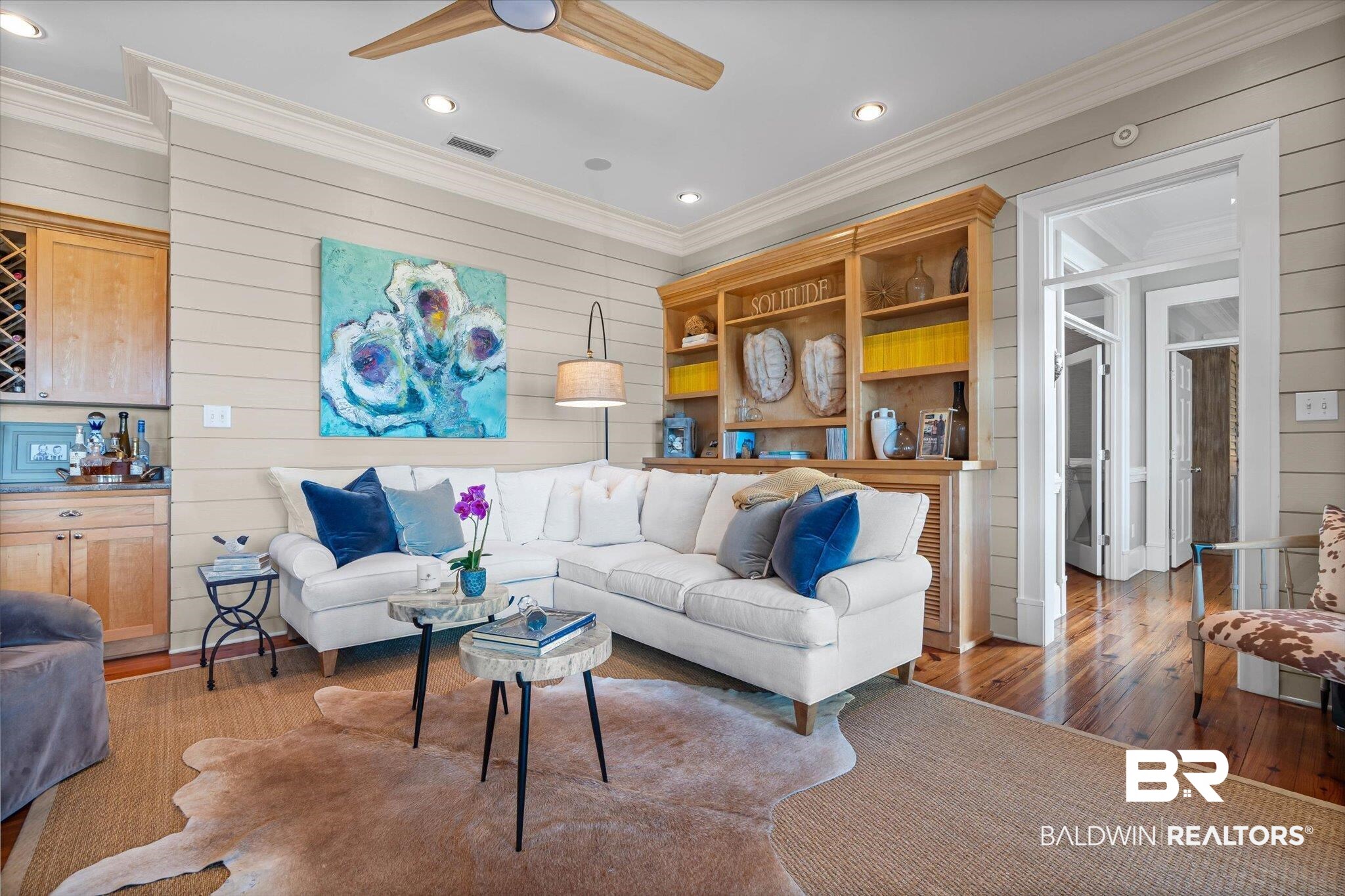 7015 Bay Road Mobile, AL 36605 - Photo 14 of 53 Living area featuring wooden walls, recessed lighting, wood-type flooring, ceiling fan, and crown molding