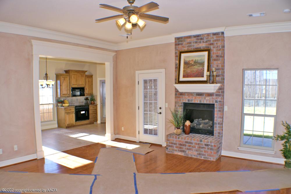 5304 Pleasant Court Amarillo, TX 79110 - Photo 2 of 13 a living room with furniture and a fireplace