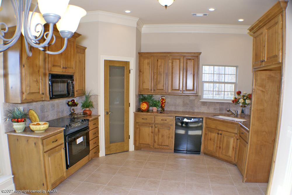 5304 Pleasant Court Amarillo, TX 79110 - Photo 4 of 13 a kitchen with stainless steel appliances granite countertop a stove and a sink