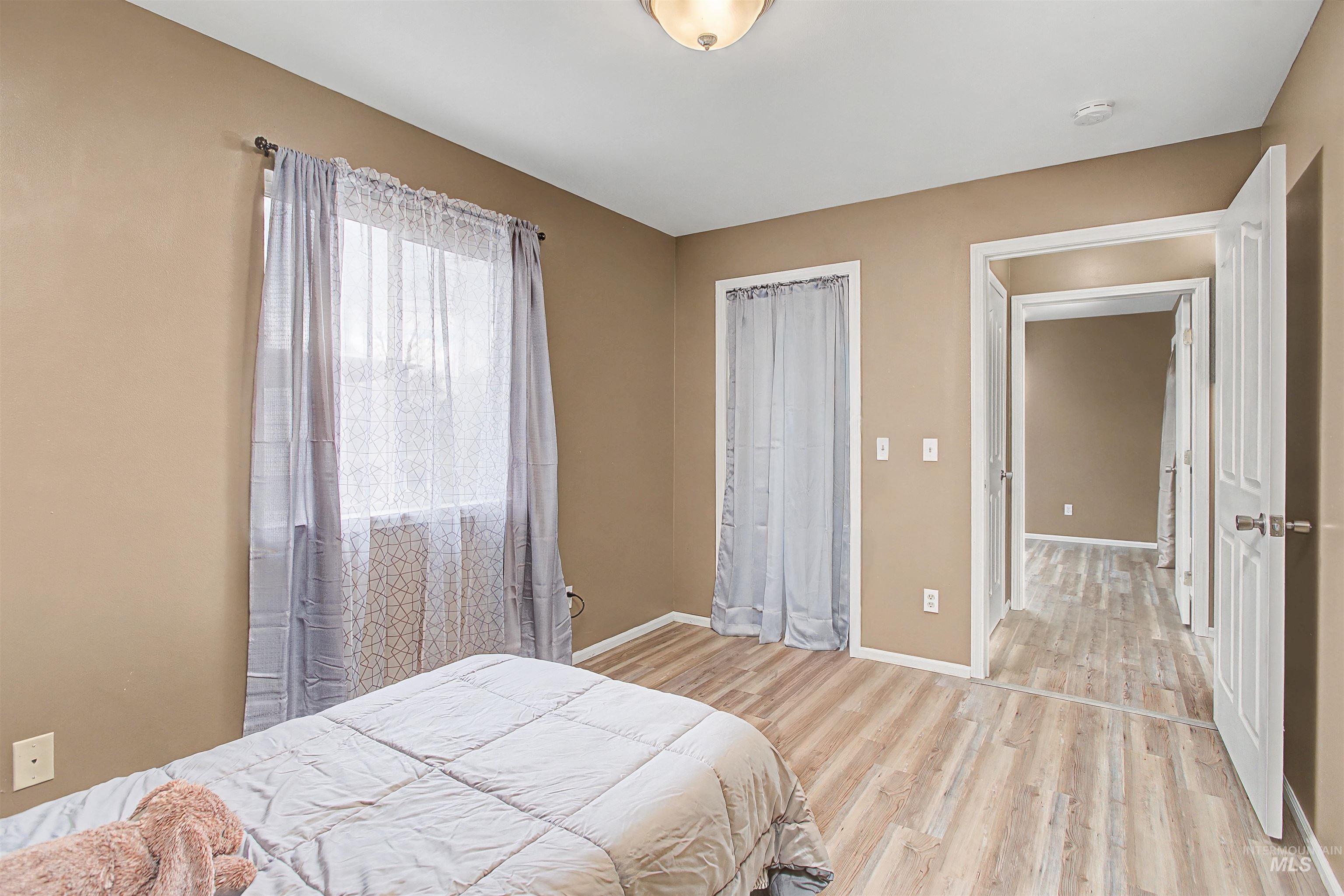 919 9th Street Clarkston, WA 99403 - Photo 3 of 34 Bedroom with light wood-type flooring and a closet