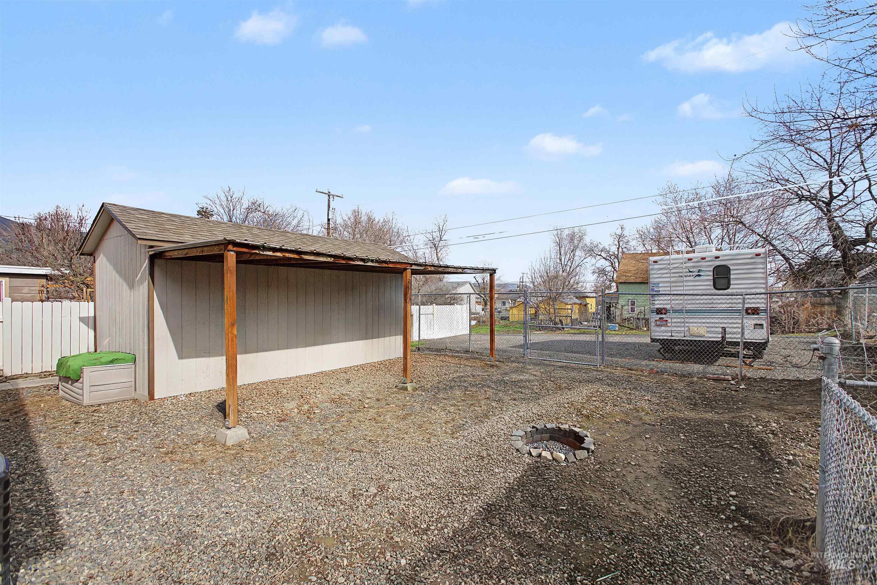 919 9th Street Clarkston, WA 99403 - Photo 34 of 34 View of home's exterior with an outdoor structure and a gate