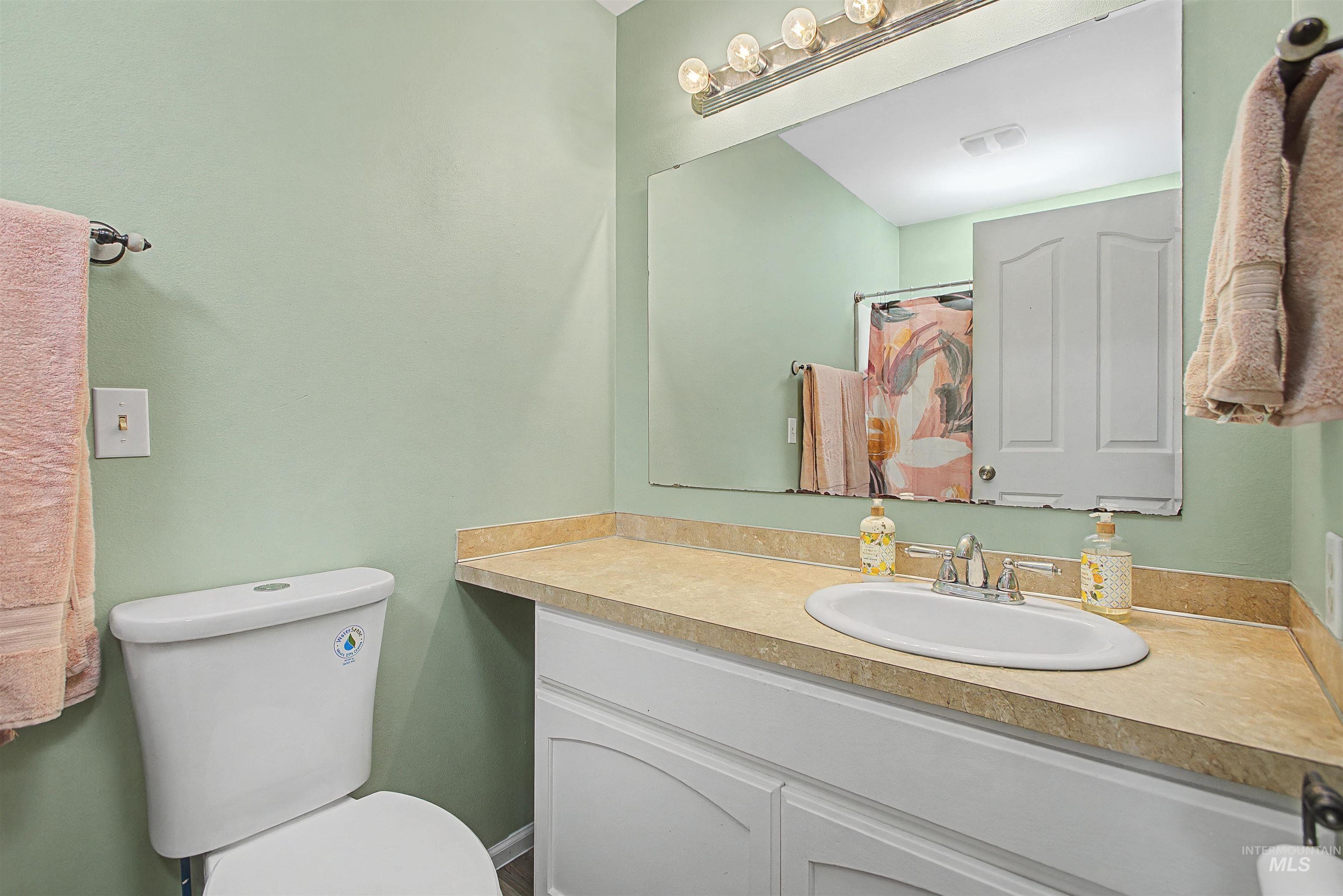 919 9th Street Clarkston, WA 99403 - Photo 7 of 34 Bathroom featuring vanity and a shower with shower curtain