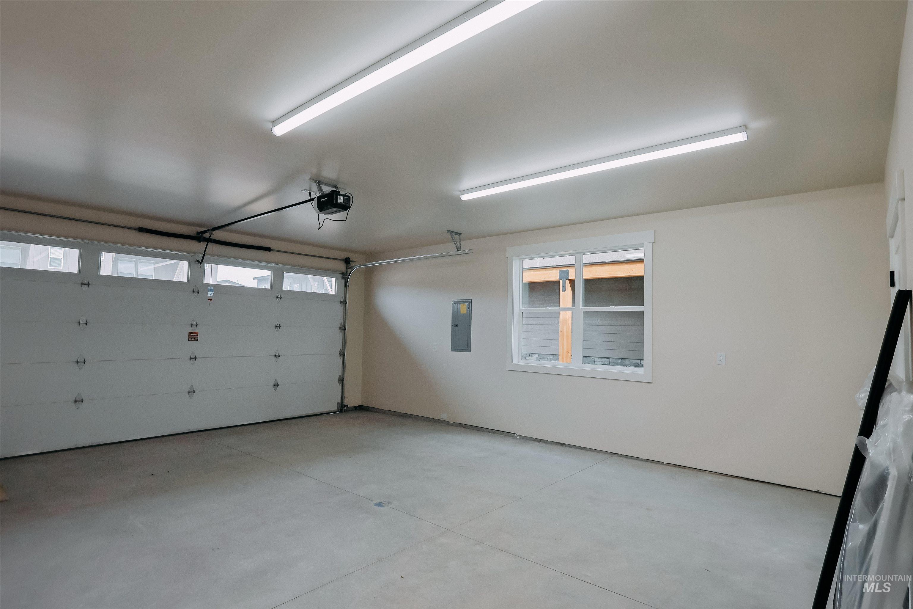 10 North Crk Way Cascade, ID 83611 - Photo 19 of 25 Garage with electric panel and a garage door opener