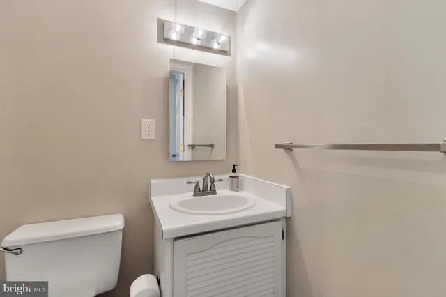 a view of house with backyard and trees