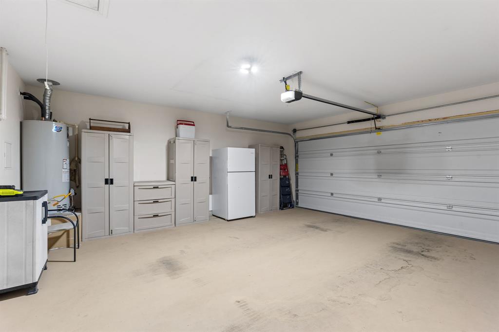 300 Copper Switch Drive Anna, TX 75409 - Photo 25 of 26 Double garage with door opener and attic storage entry