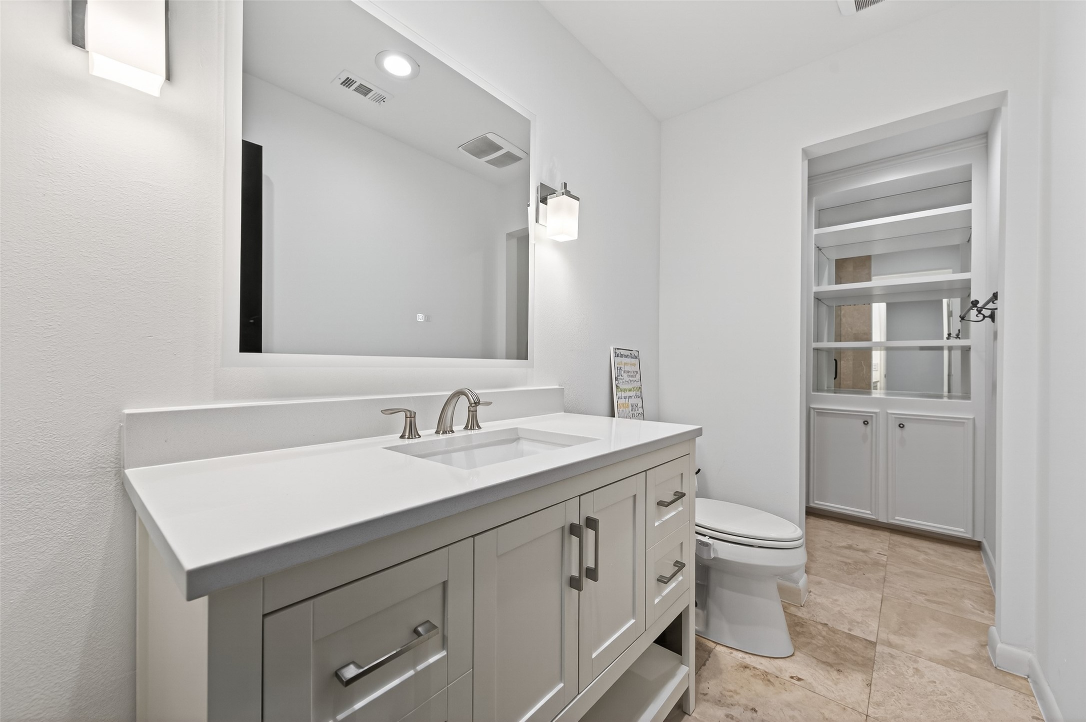 6226 Pebble Beach Drive Houston, TX 77069 - Photo 34 of 46 a bathroom with a toilet sink and mirror