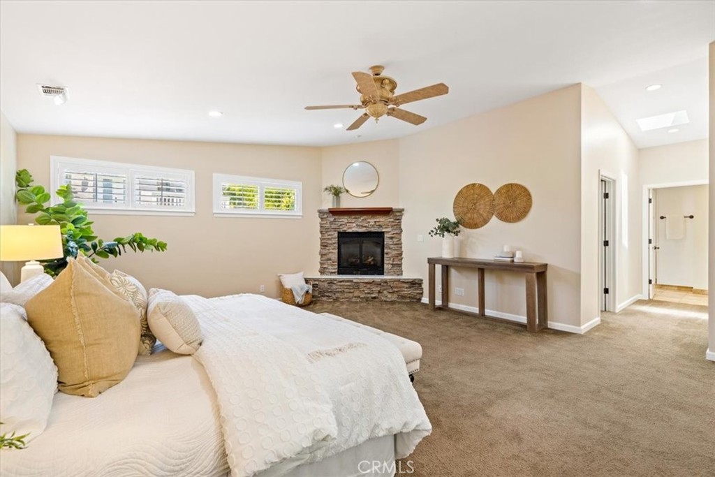 318 Indio Drive Pismo Beach, CA 93449 - Photo 18 of 58 a bedroom with a bed and a fireplace