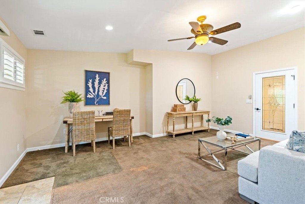 318 Indio Drive Pismo Beach, CA 93449 - Photo 26 of 58 a living room with furniture a rug and a window
