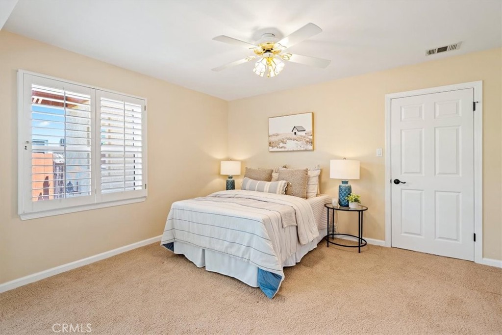 318 Indio Drive Pismo Beach, CA 93449 - Photo 29 of 58 a spacious bedroom with a bed and a window
