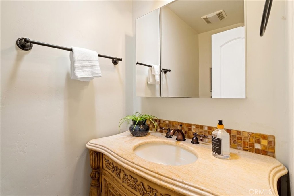 318 Indio Drive Pismo Beach, CA 93449 - Photo 35 of 58 a bathroom with a sink and a mirror