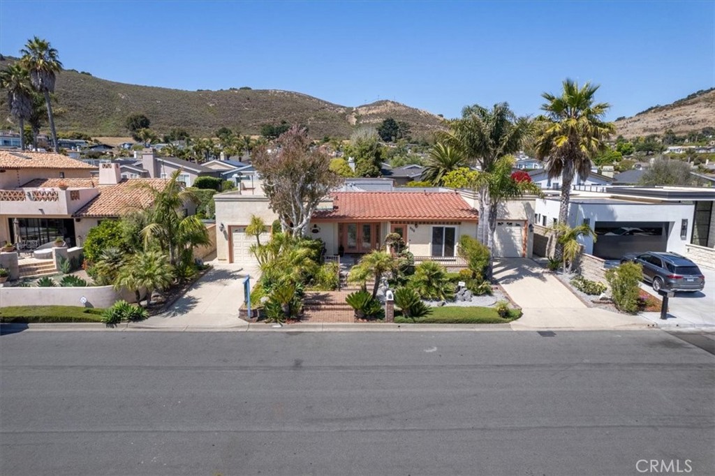 318 Indio Drive Pismo Beach, CA 93449 - Photo 41 of 58 a view of a house with sitting area and garden