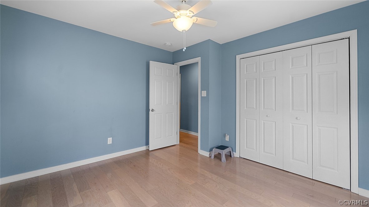2150 Genito Road Moseley, VA 23120 - Photo 24 of 36 an empty room with closet and a chandelier fan