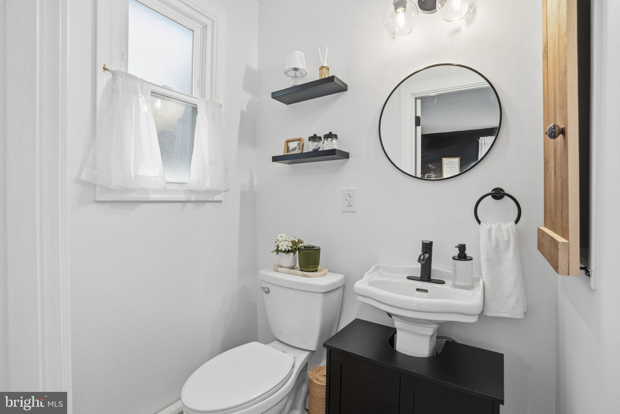 303 Radcliffe Road Glenside, PA 19038 - Photo 14 of 36 a bathroom with a toilet sink and mirror