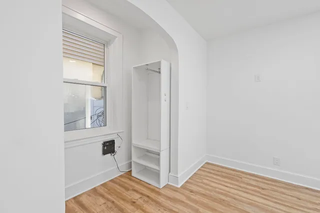 a view of a room that has a window in it