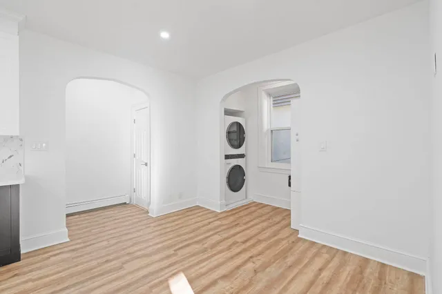a view of a room with wooden floor