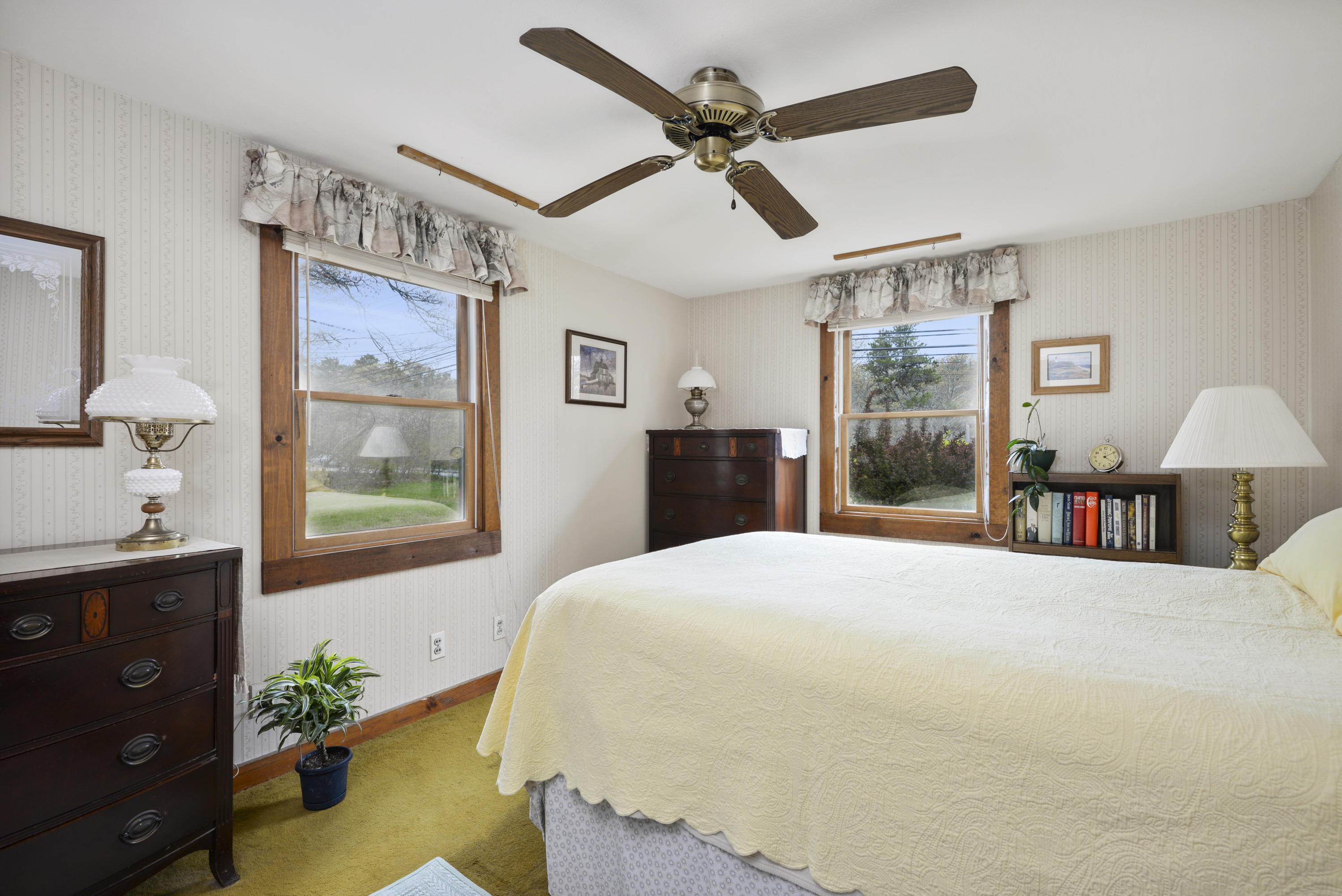 5490 State Highway Eastham, MA 02642 - Photo 11 of 28 a bed room with a bed mirror and a window