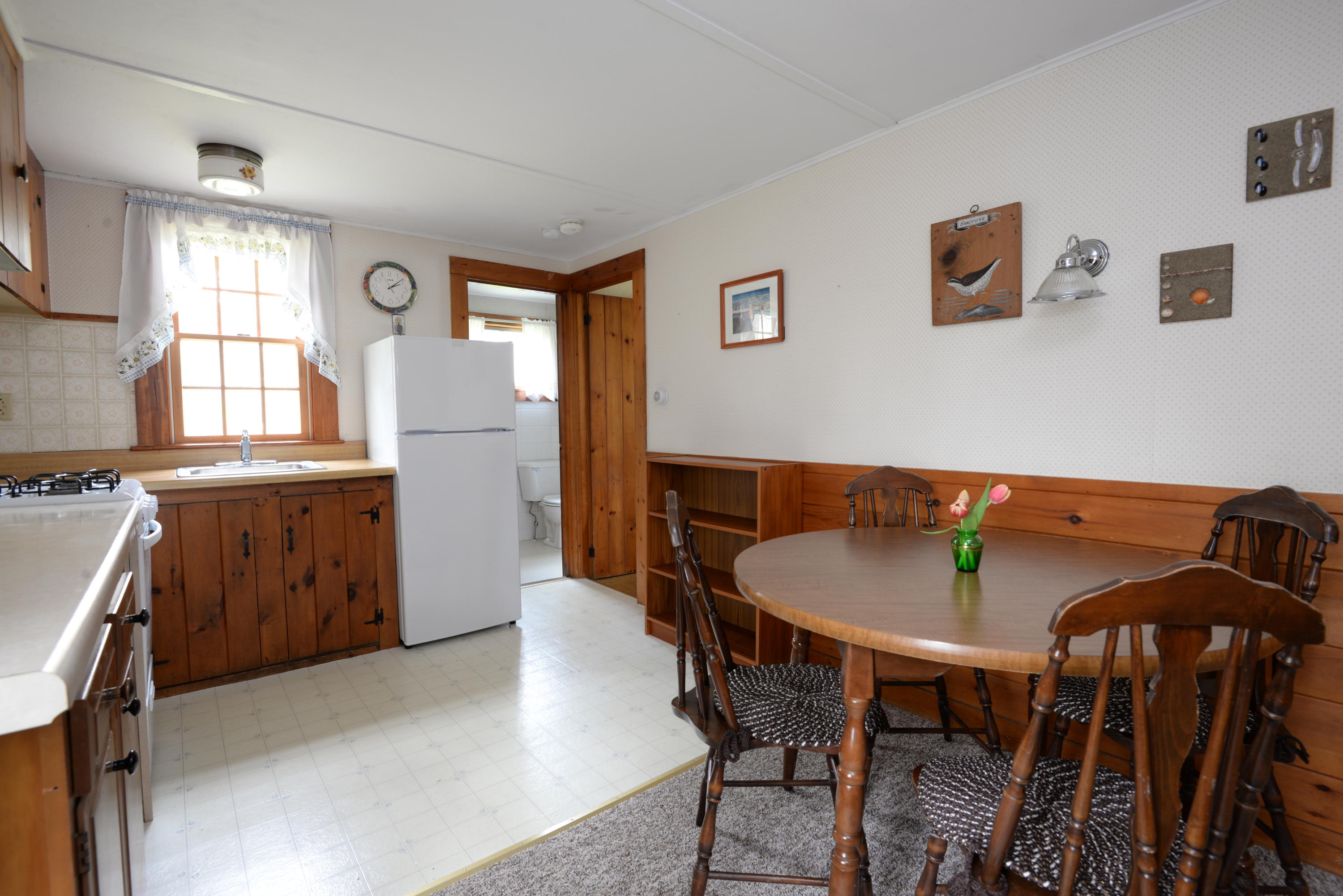 5490 State Highway Eastham, MA 02642 - Photo 14 of 28 a view of a dining room with furniture and window