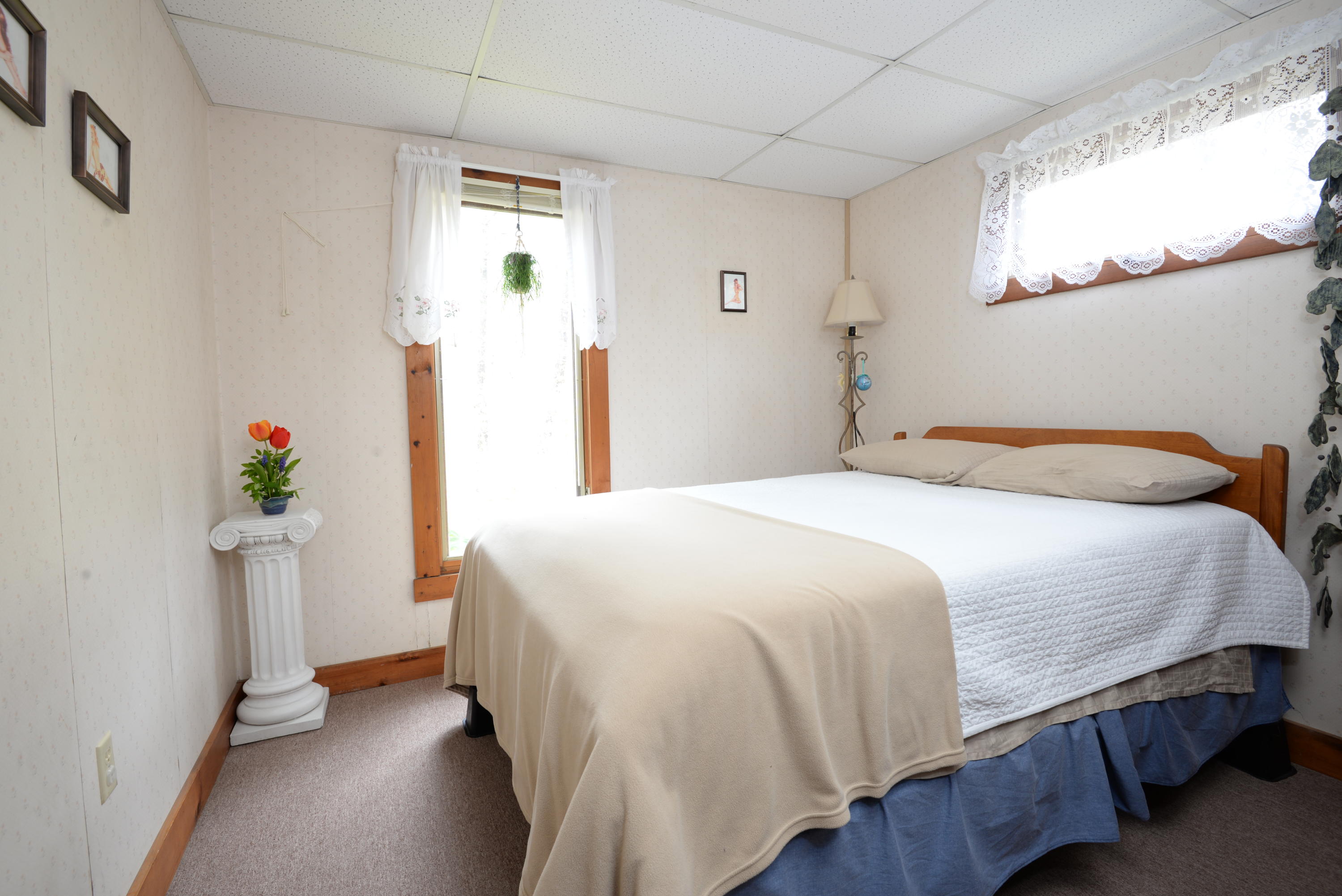 5490 State Highway Eastham, MA 02642 - Photo 16 of 28 a bedroom with a bed and a window