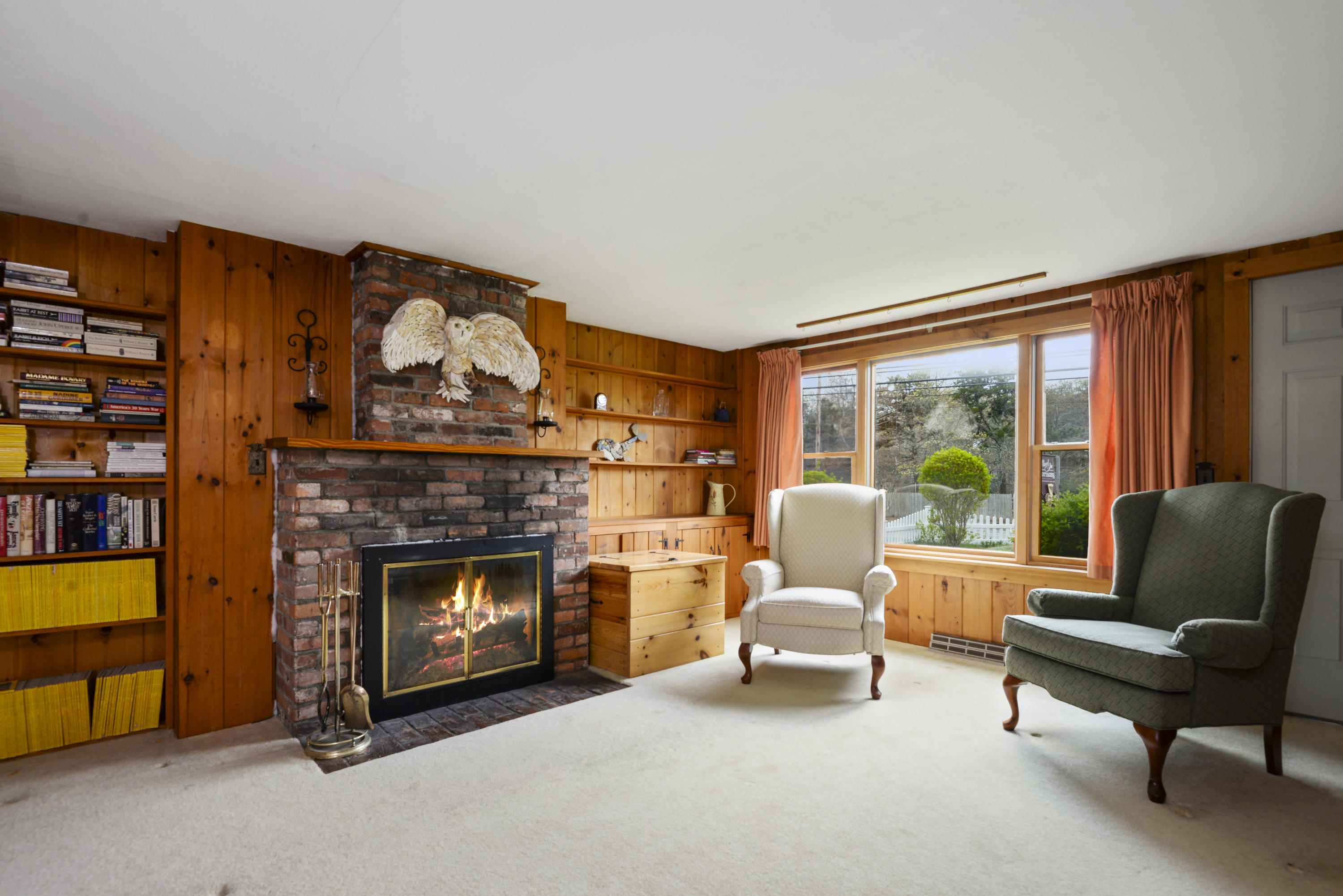 5490 State Highway Eastham, MA 02642 - Photo 5 of 28 a living room with furniture and a fireplace