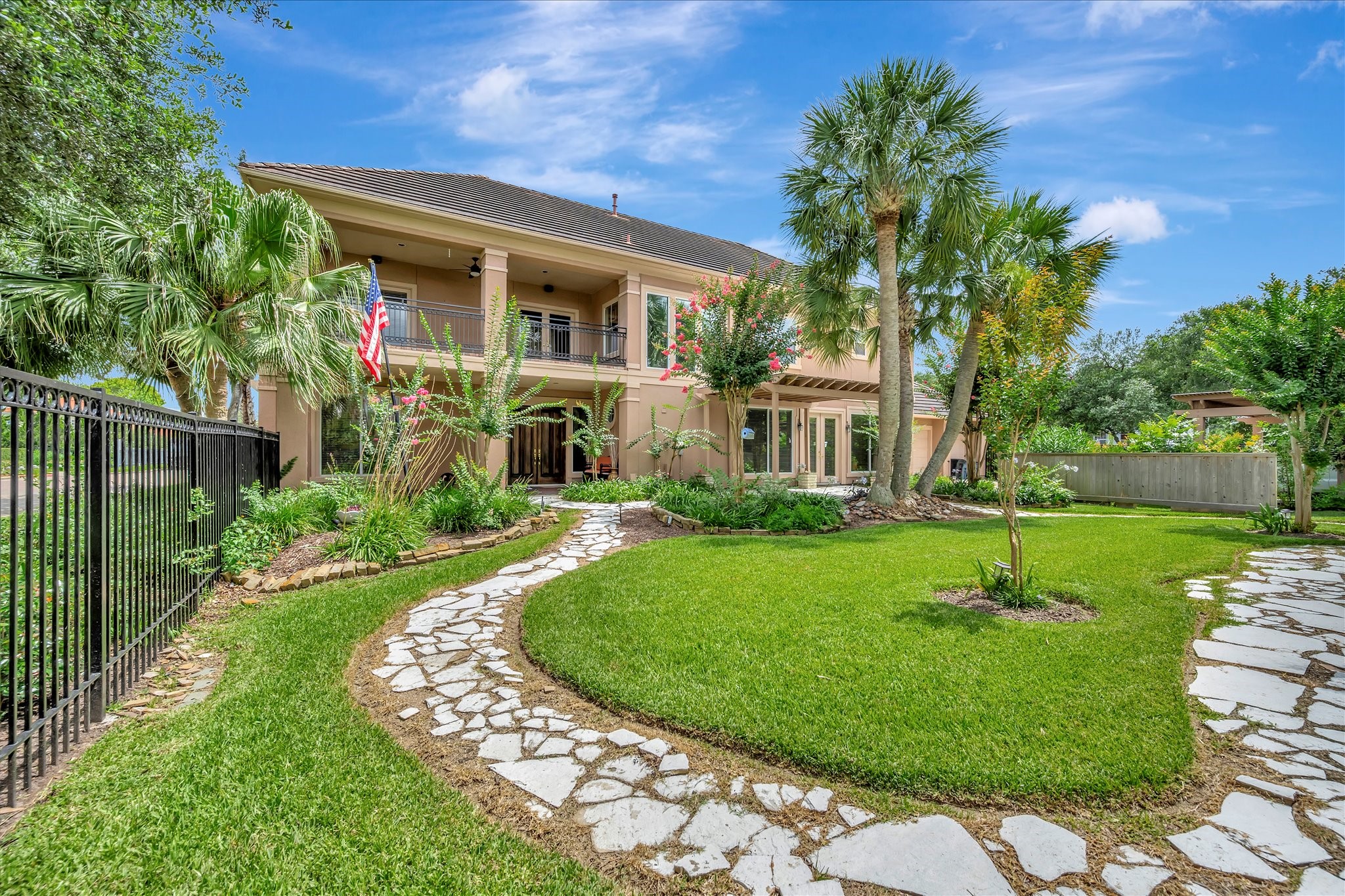 604 Harborside Way Kemah, TX 77565 - Photo 8 of 46 A FLAGSTONE WALKWAY TAKES YOU THROUGH THE PROPERTIES' GARDENS.
