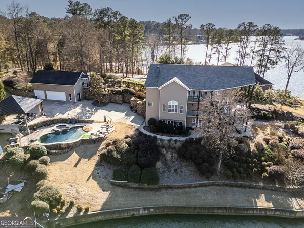 a view of a house with a yard and garden