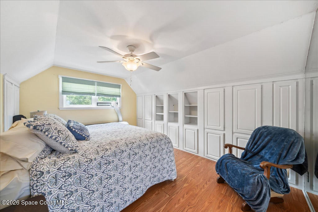 1110 Riverside Drive Titusville, FL 32780 - Photo 39 of 50 a bedroom with a large bed and a window
