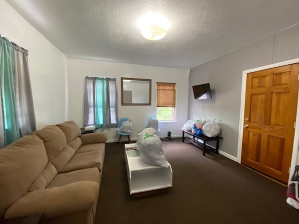 220 Vernon Street Worcester, MA 01607 - Photo 20 of 29 a living room with furniture and a window