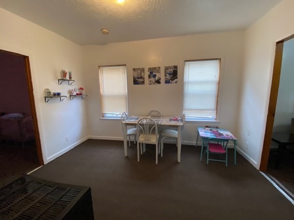 220 Vernon Street Worcester, MA 01607 - Photo 21 of 29 a dining room with furniture and window