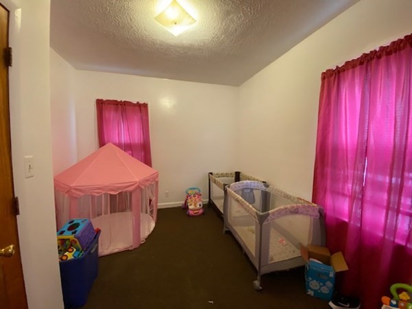 220 Vernon Street Worcester, MA 01607 - Photo 22 of 29 a living room with furniture and a window