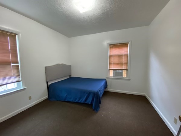 220 Vernon Street Worcester, MA 01607 - Photo 24 of 29 a room with a window and a lamp