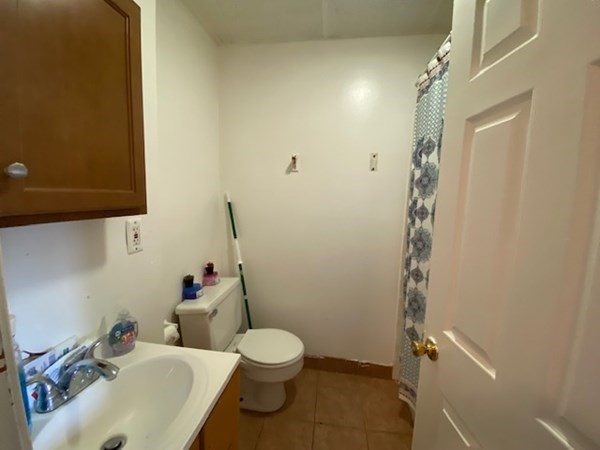 220 Vernon Street Worcester, MA 01607 - Photo 25 of 29 a bathroom with a sink toilet and shower