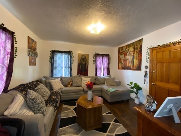 220 Vernon Street Worcester, MA 01607 - Photo 10 of 29 a living room with furniture and a window