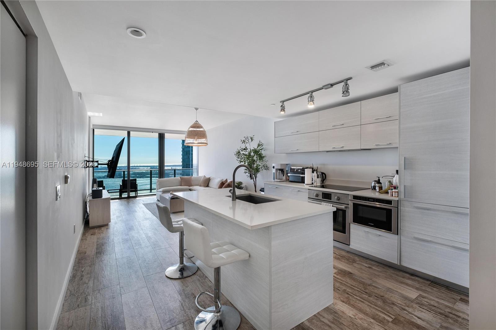 650 Northeast 32nd Street, Unit 4306 Miami, FL 33137 - Photo 12 of 52 a kitchen with sink stove and refrigerator