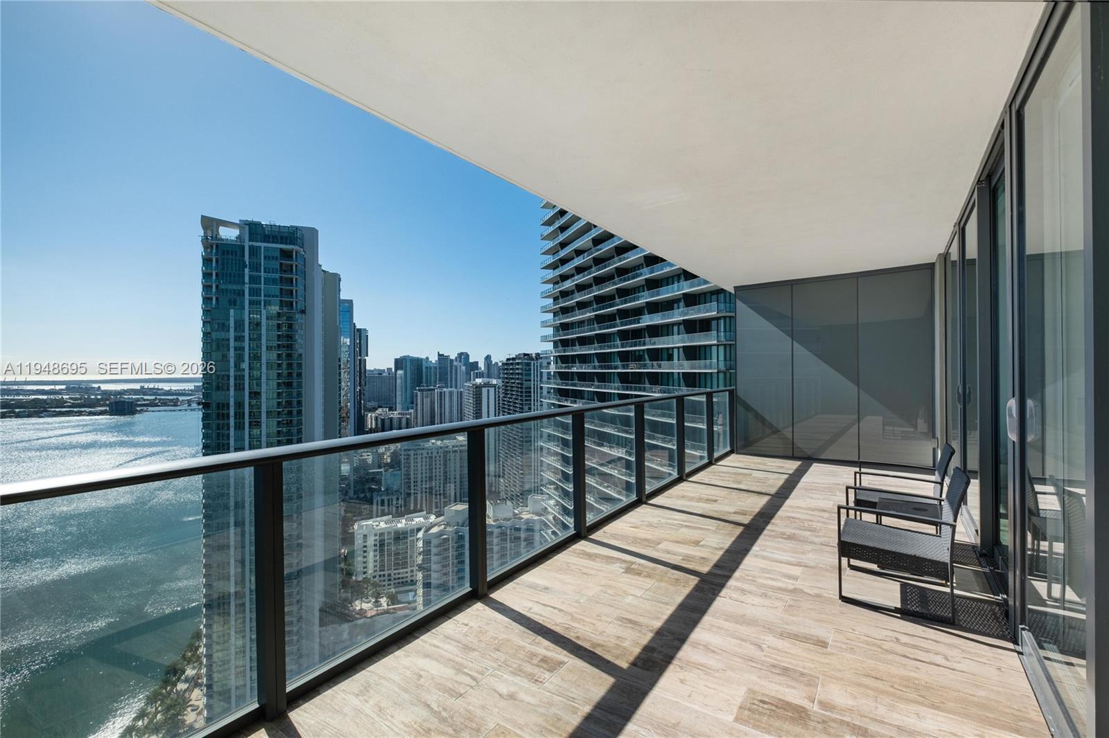 650 Northeast 32nd Street, Unit 4306 Miami, FL 33137 - Photo 14 of 52 a view of balcony with floor to ceiling windows and wooden floor