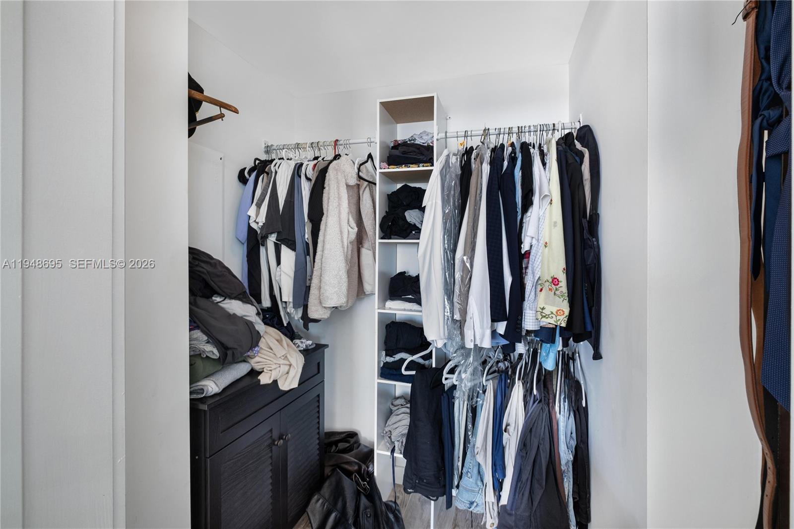 650 Northeast 32nd Street, Unit 4306 Miami, FL 33137 - Photo 19 of 52 a view of walk in closet with clothes