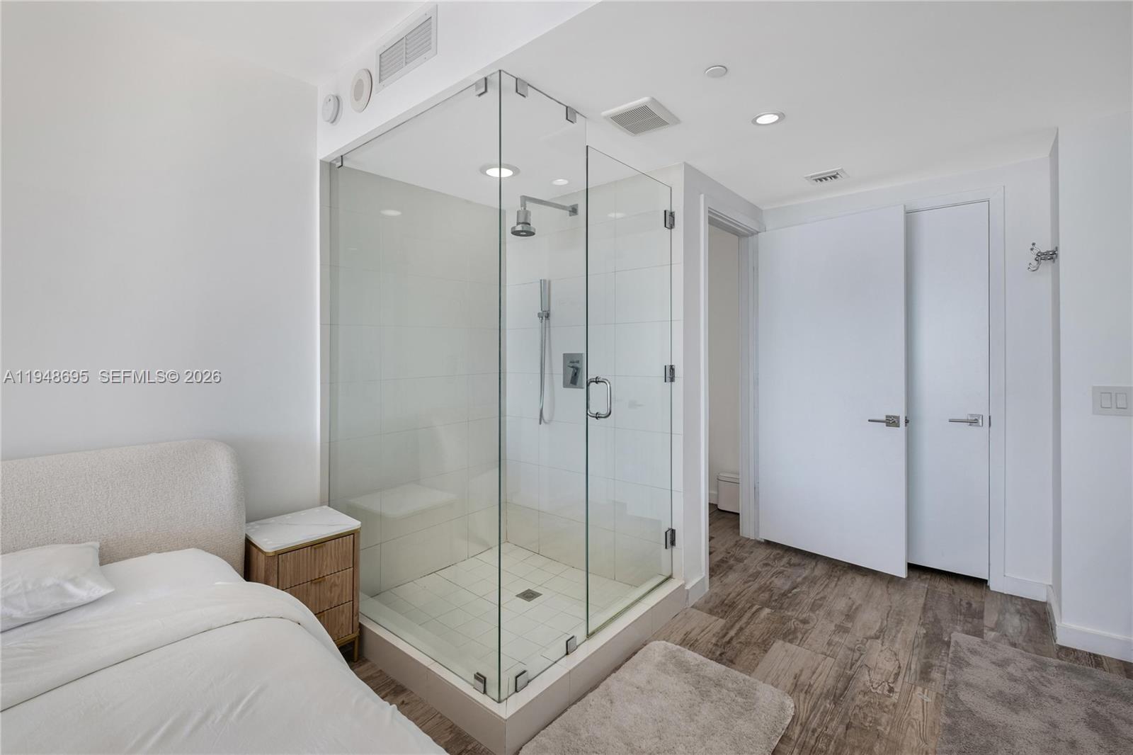 650 Northeast 32nd Street, Unit 4306 Miami, FL 33137 - Photo 21 of 52 a bathroom with a shower and a sink