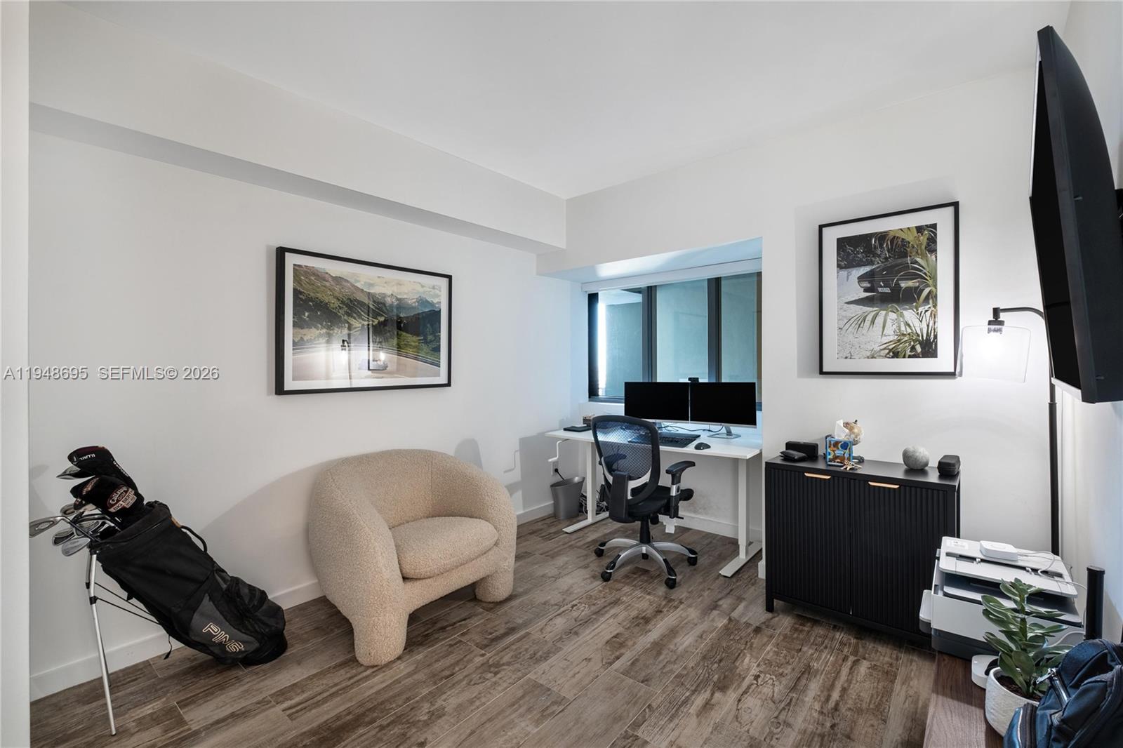 650 Northeast 32nd Street, Unit 4306 Miami, FL 33137 - Photo 23 of 52 a living room with furniture and a flat screen tv